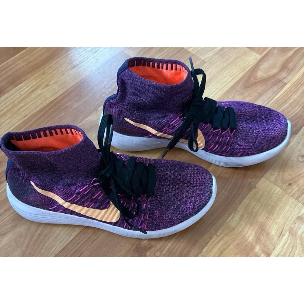 Nike LunarEpic Flyknit running shoes in a purple colorway with an orange swoosh.